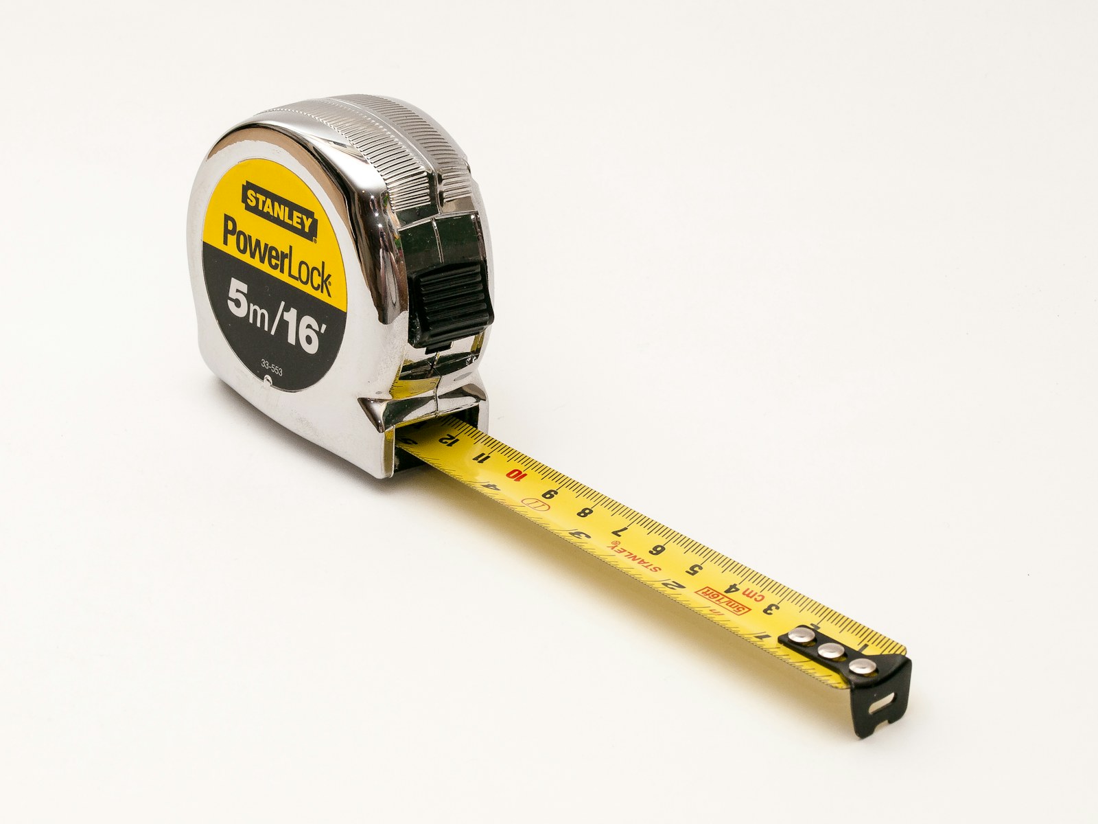 A yellow tape measure showing centimetre markings